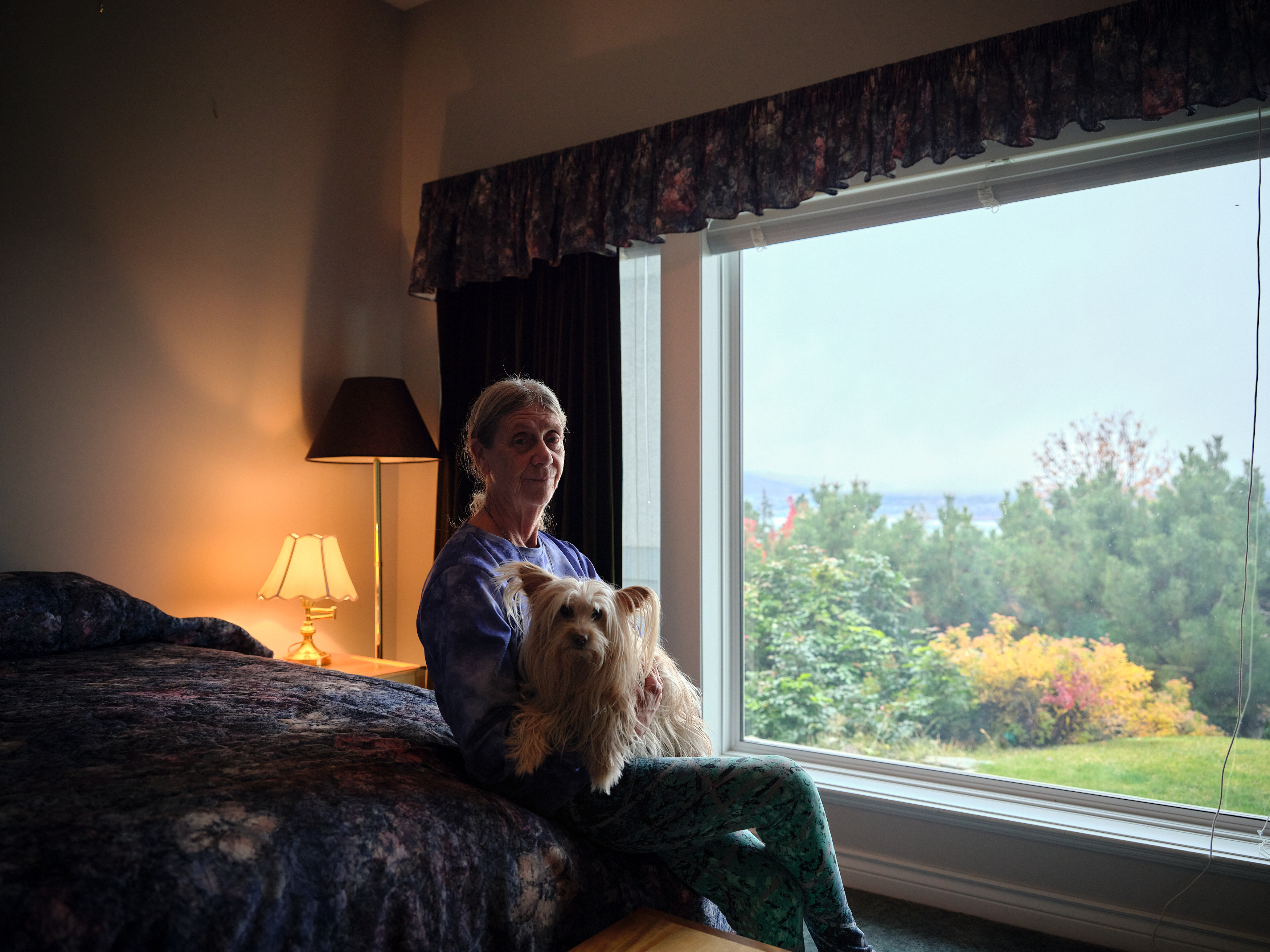 Jerry at home with their dog.