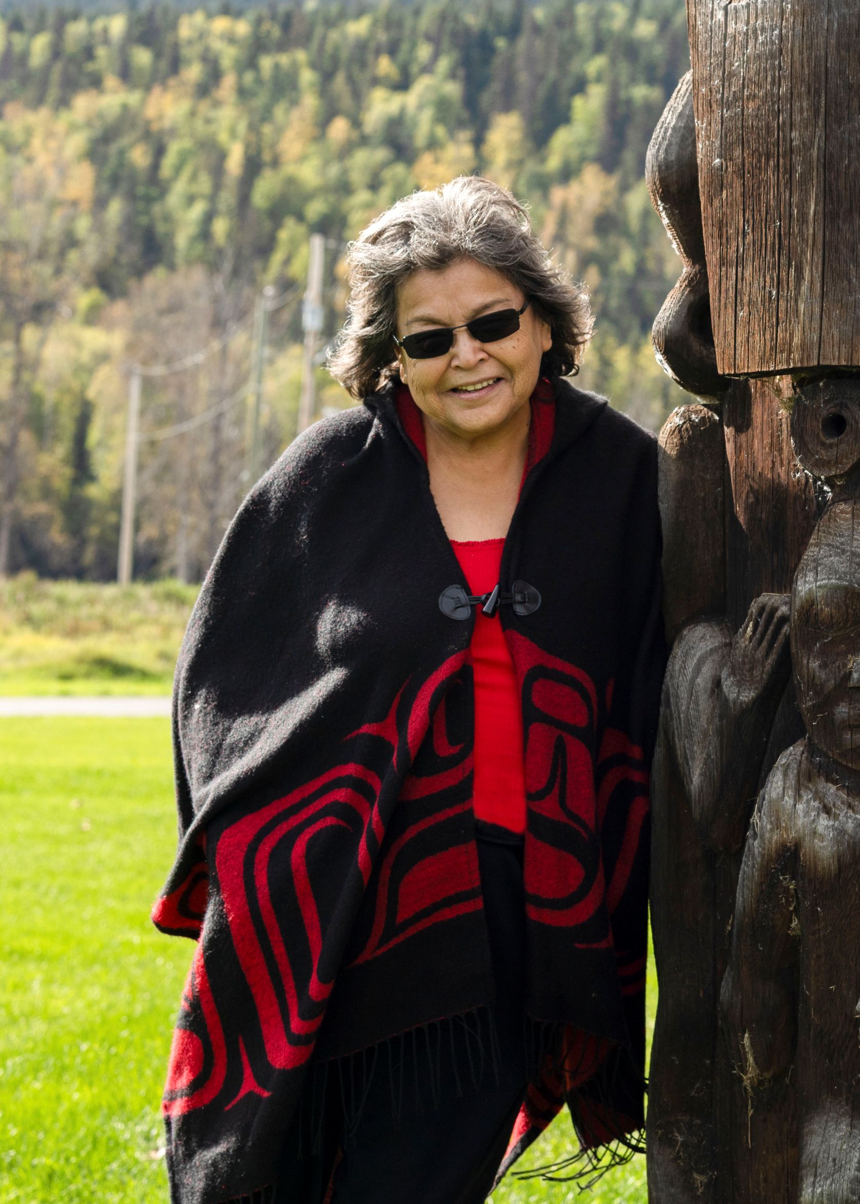 Kay Wilson by the&nbsp;Aspayaxw&nbsp;Totem Poles.